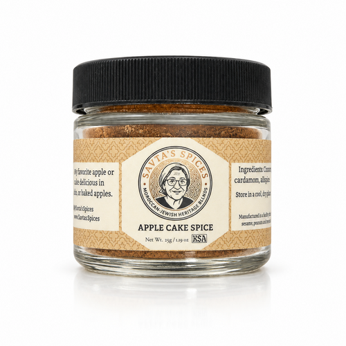 A glass jar of Savta's Spices Apple Cake Spice with a black lid and a beige label, shown on a white background.