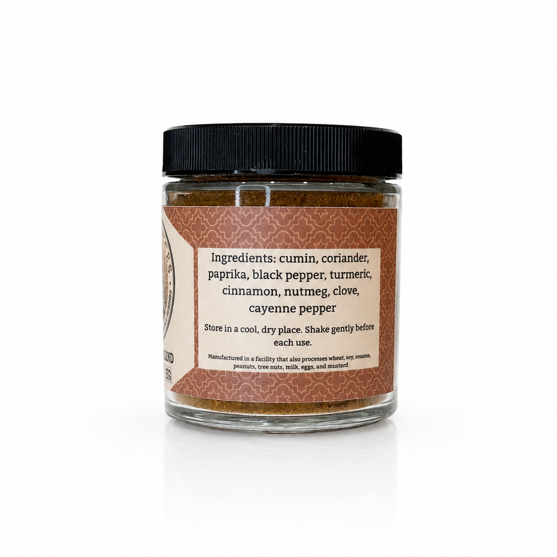 A glass jar of Habanero Pepper seasoning with a black lid and a brown label, set against a plain white background with a soft reflection.