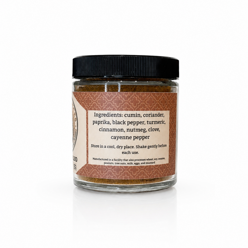 A glass jar of Habanero Pepper seasoning with a black lid and a brown label, set against a plain white background with a soft reflection.