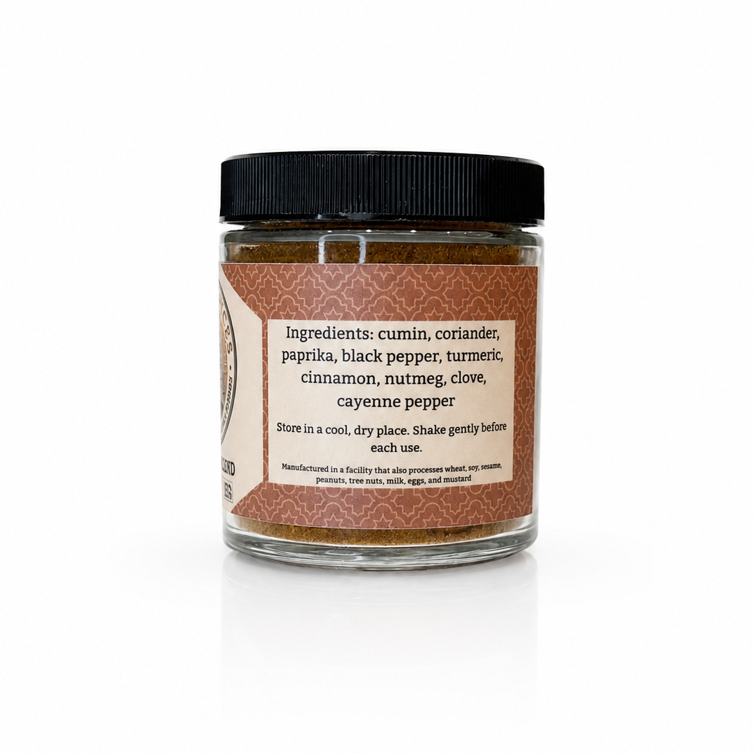 A glass jar of Habanero Pepper seasoning with a black lid and a brown label, set against a plain white background with a soft reflection.