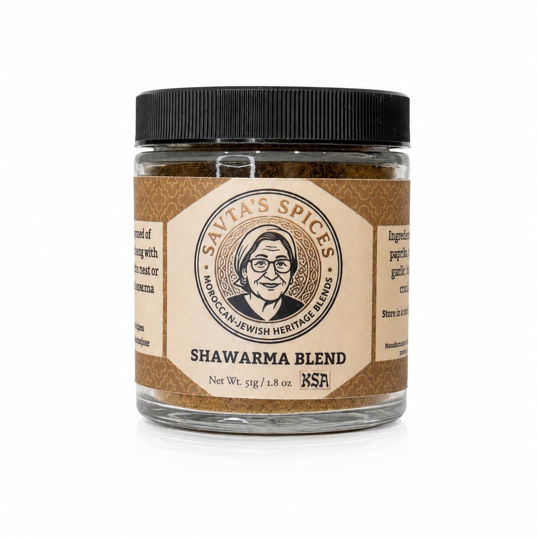 A jar of Savta's Spices Shawarma Blend seasoning with a black lid and a tan label featuring a vintage-style portrait of a man, set against a plain white background.