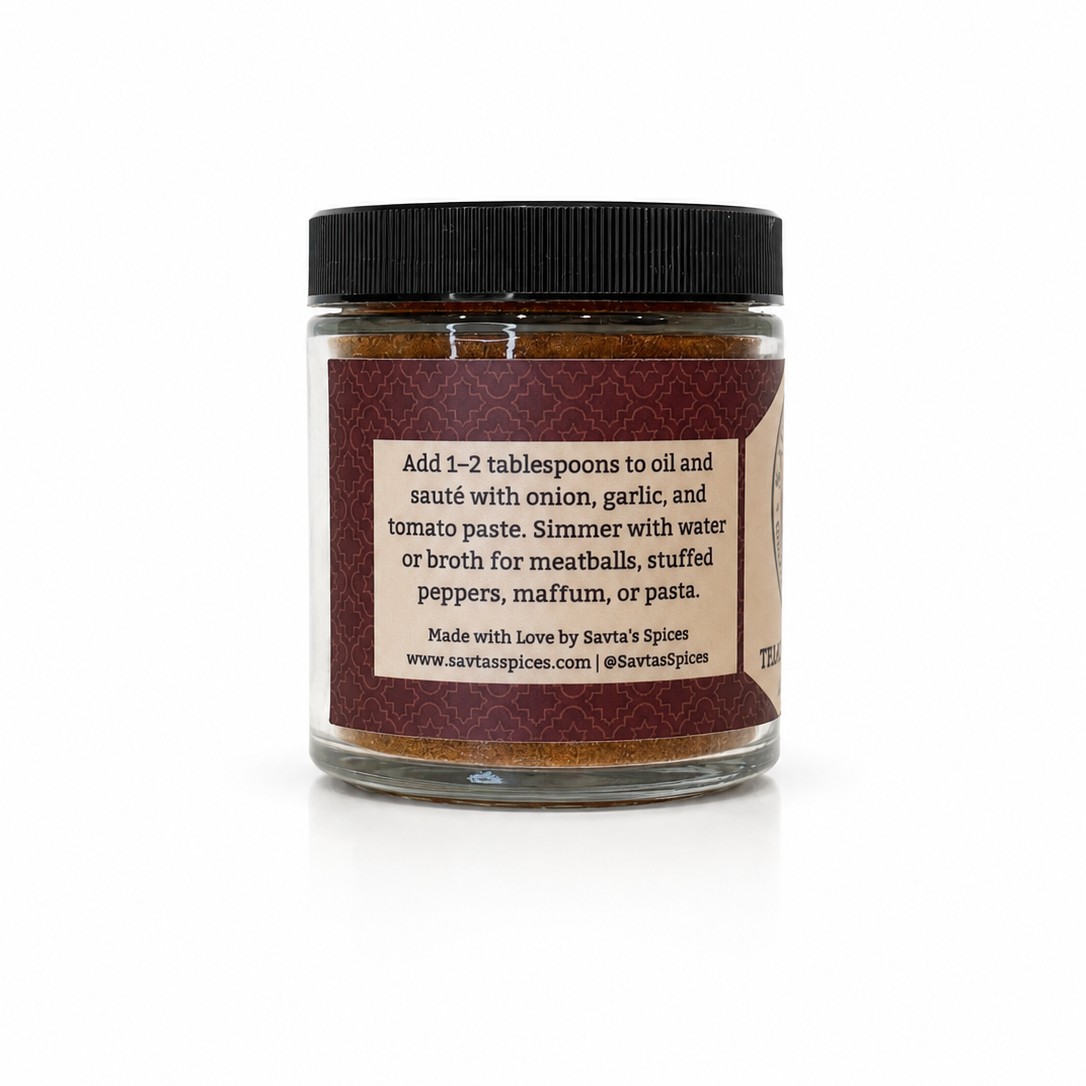 A glass jar of Savta's Spices meatball seasoning with a black lid and a brown label, shown on a white background with a soft shadow.
